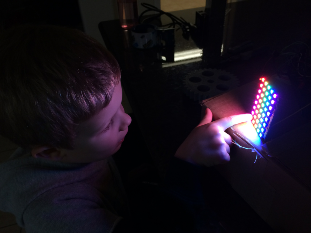 my son watching an LCD array run a sequence